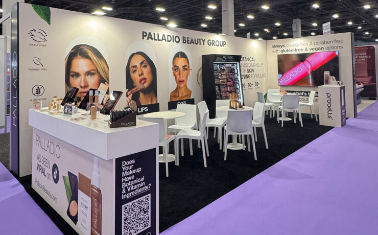Palladio Beauty Group booth at Cosmoprof North America Las Vegas 2026 featuring makeup displays, meeting areas and branded product visuals.