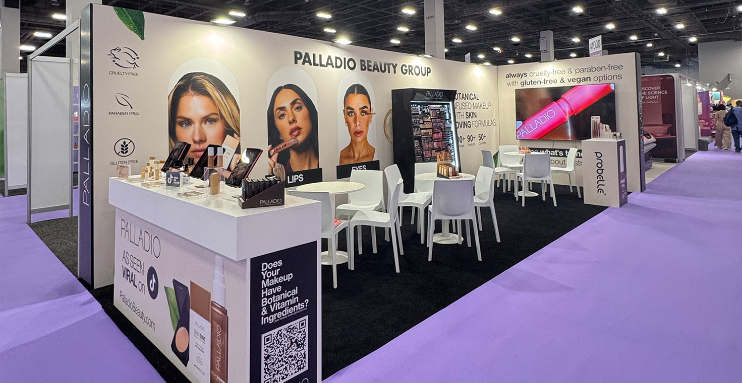Palladio Beauty Group booth at Cosmoprof North America Las Vegas 2026 featuring makeup displays, meeting areas and branded product visuals.